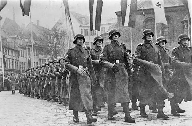 Latvian SS division parade through Riga before deployment to Eastern Front. December 1943 Latvian SS division parade through Riga before deployment to Eastern Front. December 1943